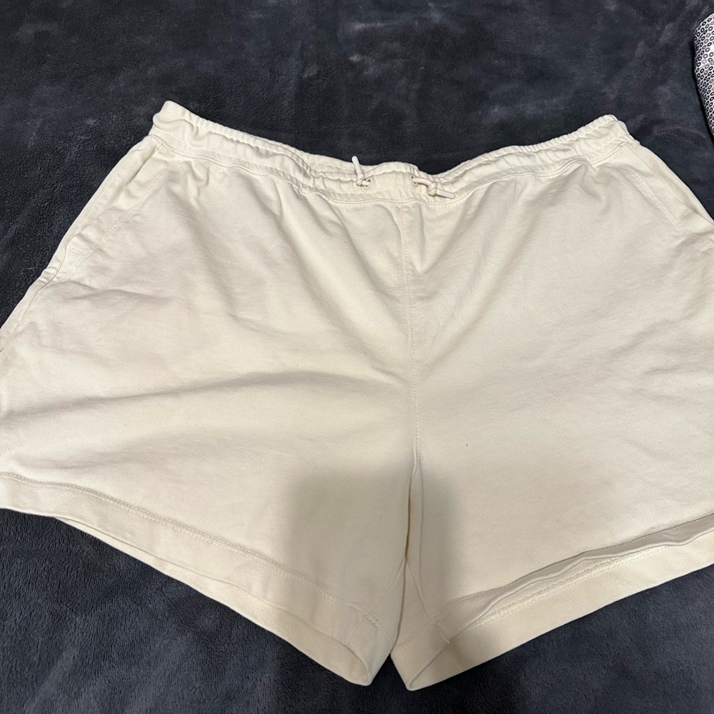 Light yellow Nike athletic shorts with draw string